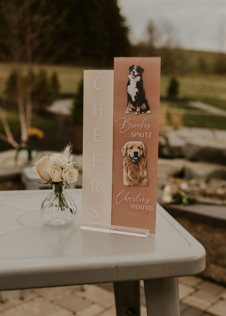 The drink menu is on the table at a wedding, with signature drinks named after the dog.